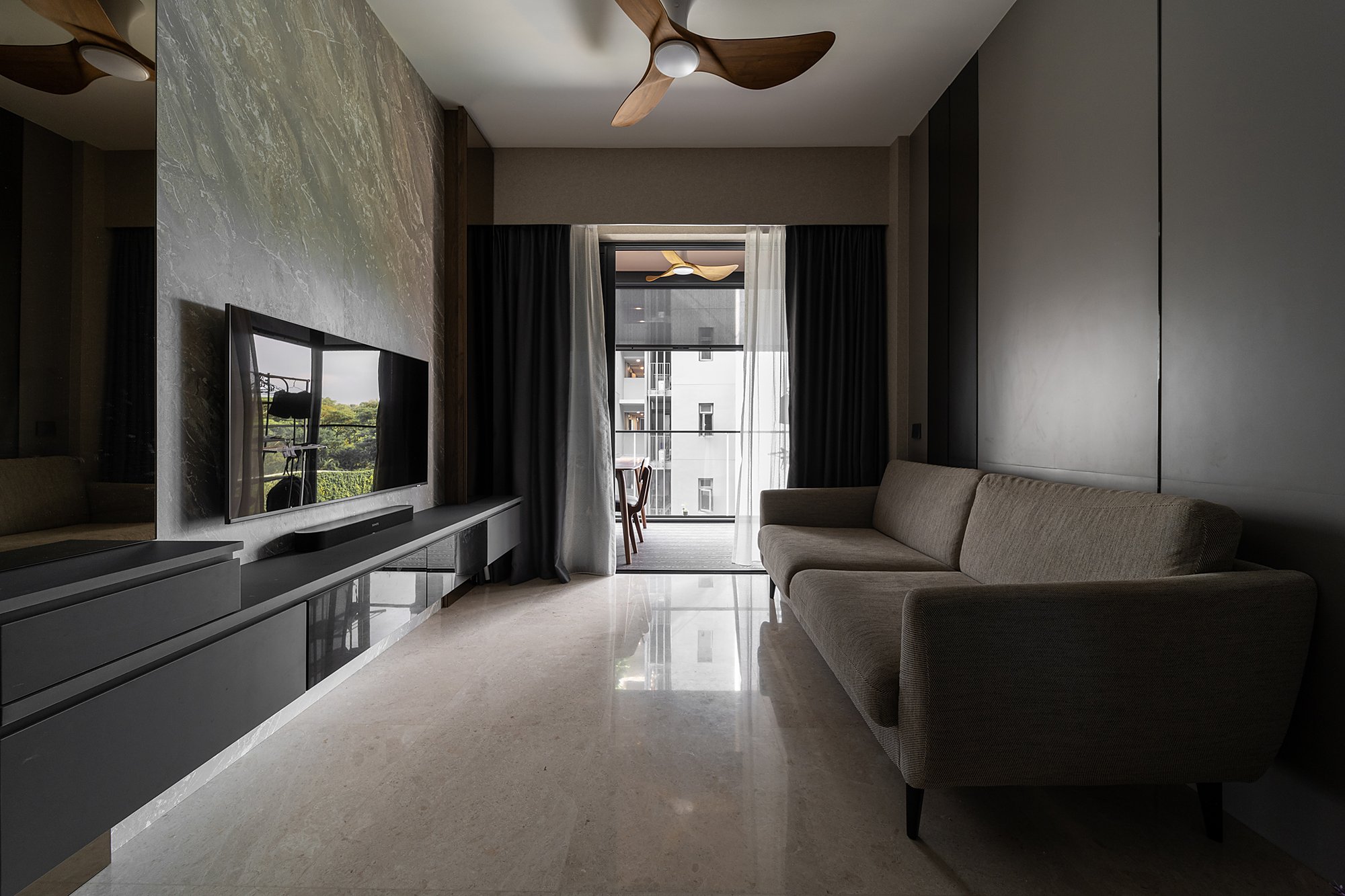 Modern living room interior with fluted timber feature wall by Creo Studio